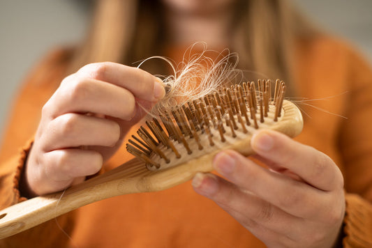 Understanding Postpartum Hair Loss: Causes, Symptoms, Treatments, and Prevention